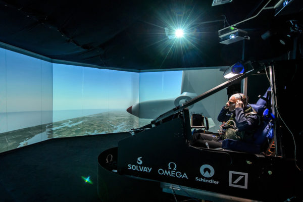 Swiss scientist-adventurer and pilot Bertrand Piccard sits in the near-exact reconstruction of the cockpit of the sun-powered aircraft Solar Impulse HB-SIB at the beginning of a non-stop 72 hours simulation test flight inside on December 17, 2013 at the former military airport of Duebendorf, near Zurich. The goal of the experience is to prepare Piccard and pilot Andre Borschberg for their 2015 long-duration round-the-world flights. AFP PHOTO / FABRICE COFFRINI (Photo credit should read FABRICE COFFRINI/AFP/Getty Images)
