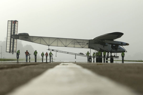 The Solar Impulse 2 aircraft is pulled out of its base for tests by pilot Bertrand Piccard in Payerne, November 1, 2014. The aircraft weighs 2.4 tons with a wingspan of 72 meters, fitted with more than 17,000 solar cells. The attempt to fly around the world in stages using only solar energy will be made in 2015. REUTERS/Pierre Albouy (SWITZERLAND - Tags: TRANSPORT ENVIRONMENT SCIENCE TECHNOLOGY) - RTR4CGCU