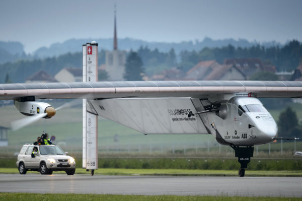 German test pilot Markus Scherdel lands the new experimental aircraft "Solar Impulse 2", after its first flight at the airbase in Payerne, Switzerland, on June 2, 2014. The aircraft, which was unveiled April 9, 2014 weighs 2.4 tons with a wingspan of 72 meters and more than 17,000 solar cells. The attempt to fly around the world in stages using only solar energy will be made in 2015. AFP PHOTO / POOL / LAURENT GILLIERON (Photo credit should read LAURENT GILLIERON/AFP/Getty Images)